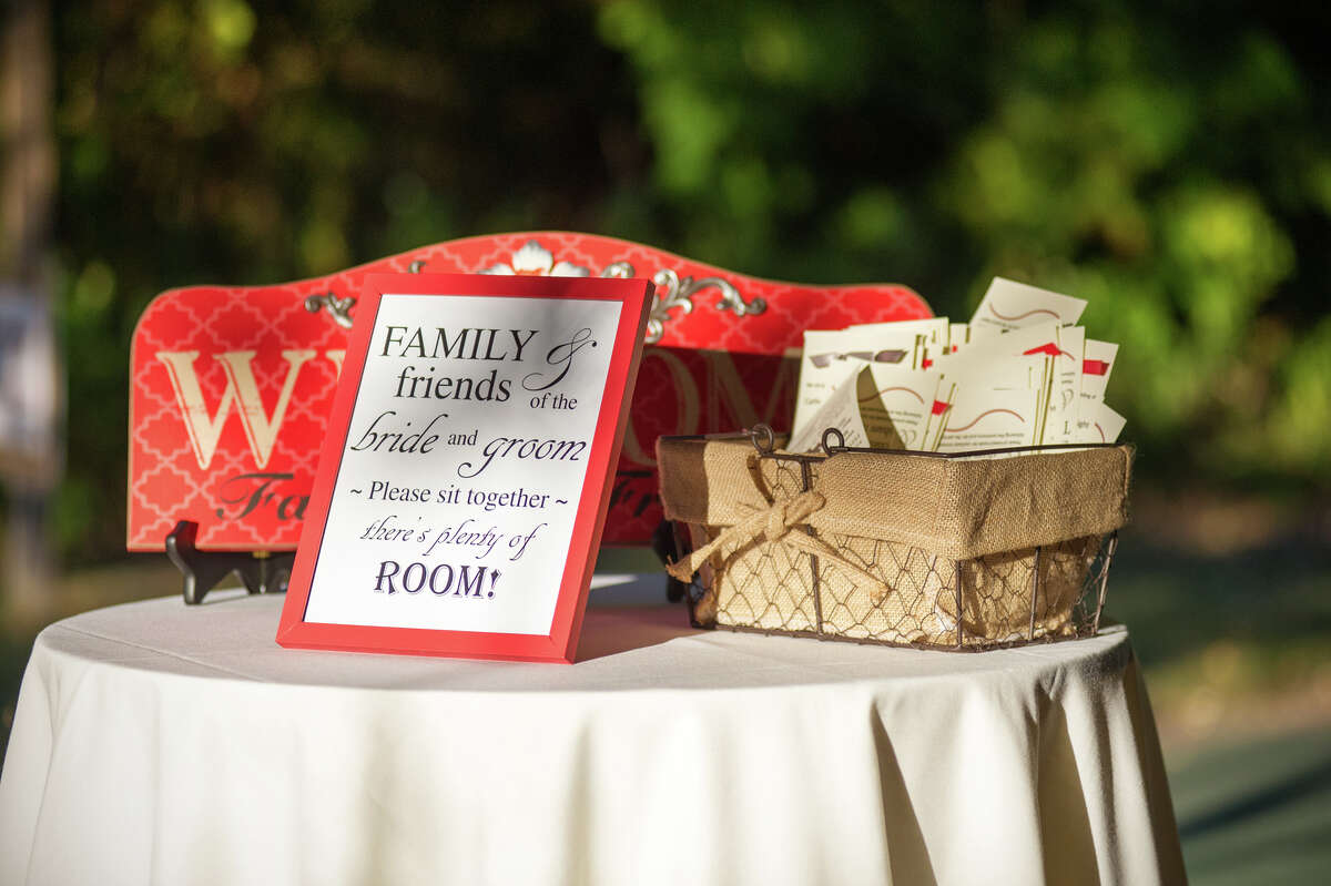 The couple decided against traditional seating arrangements and put up a sign at the entryway of their reception tent encouraging the 135 guests to mingle.