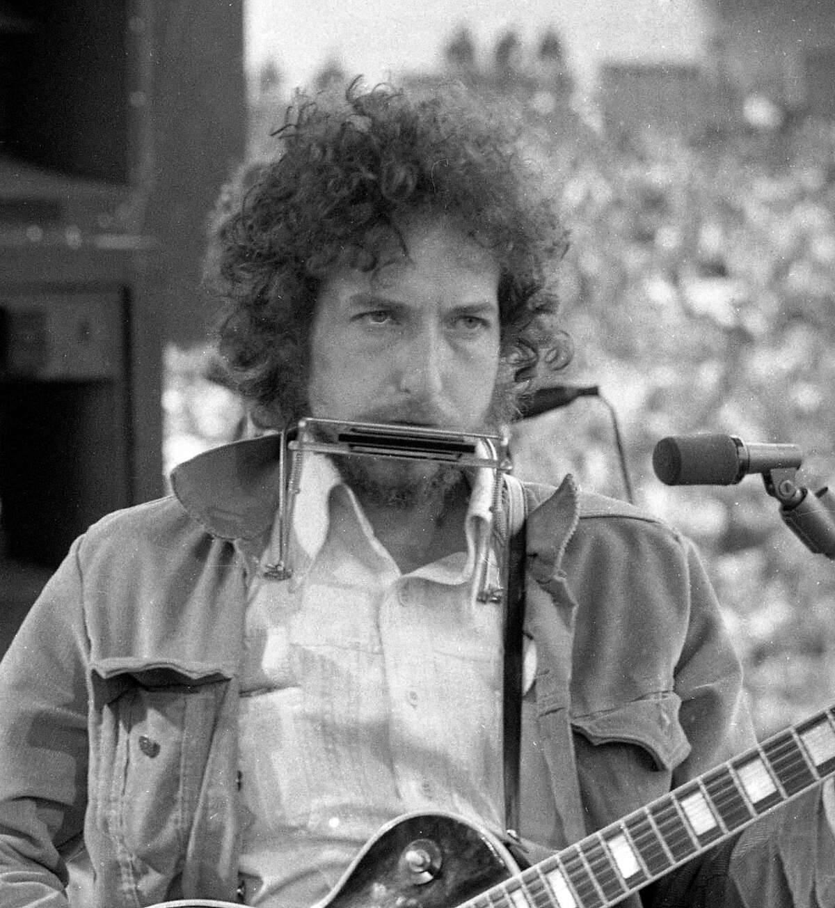 March 23, 1975: Bob Dylan makes a surprise appearance at the SNACK concert, a Kezar Stadium benefit organized by Bill Graham to save San Francisco high school sports. The benefit included performances by Jerry Garcia and Carlos Santana and appearances by Marlon Brando and Willie Mays.