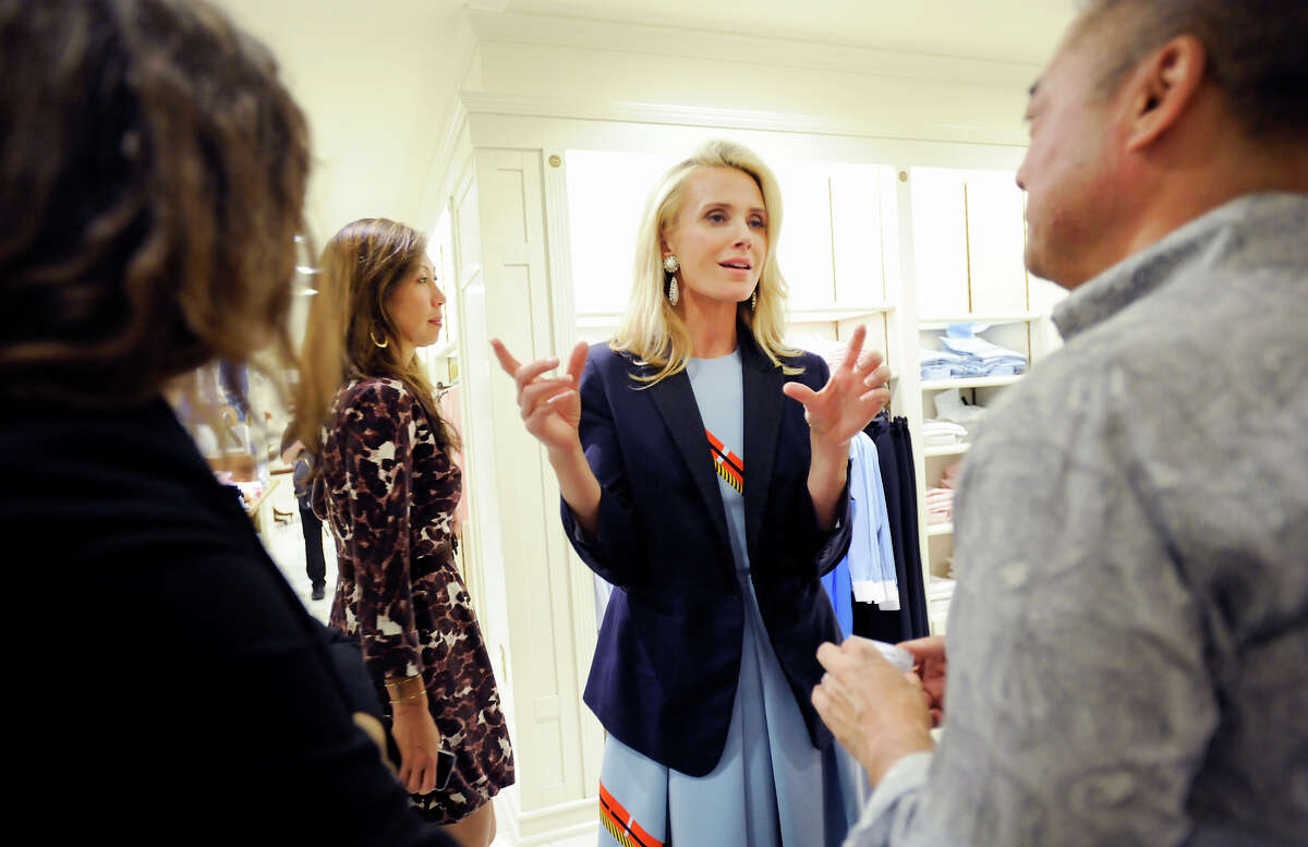 Director Jennifer Siebel Newsom (center) talks with guests during a reception for her new film, “The Mask You Live In,” at Brooks Bros. in San Francisco. The film is a follow-up to her girl-focused documentary, “Miss Representation.”