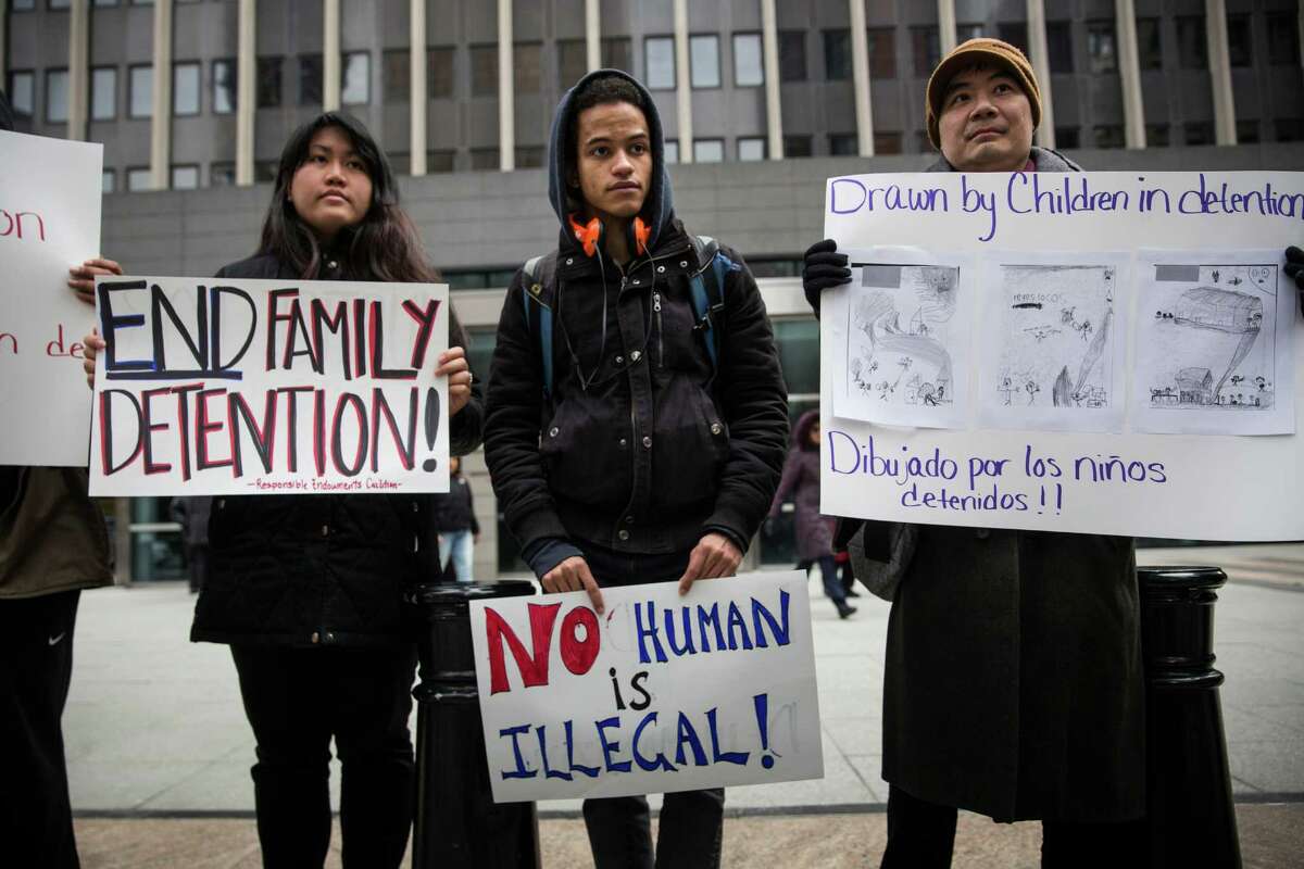 NEW YORK, NY - MARCH 24: Activists protest for the release of families held in detention centers in Texas and for the closing of the family detention centers on March 24, 2015 in New York City. The protesters rallied outside the Jacob K Javits Federal building, where immigration offices are located. (Photo by Andrew Burton/Getty Images) ORG XMIT: 544700235