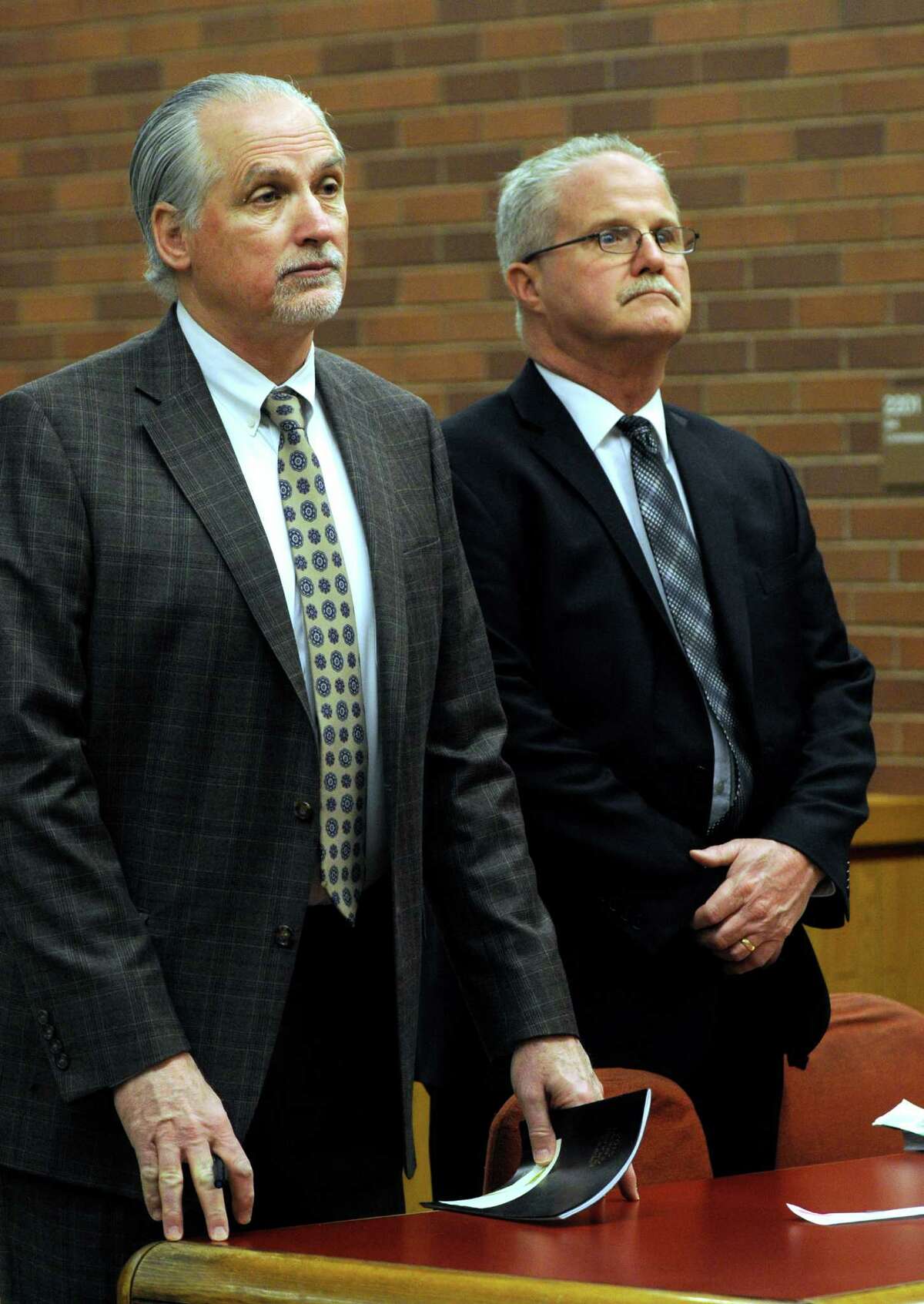 BrookfieldâÄôs former school finance director Art Colley, right, appears in Superior Court in Danbury, Conn., Wednesday morning, March 25, 2015, alongside his attorney, Eugene Riccio. Colley has been charged with second-degree larceny and third-degree forgery after police said he tried to claim reimbursement for three iPads he never purchased.