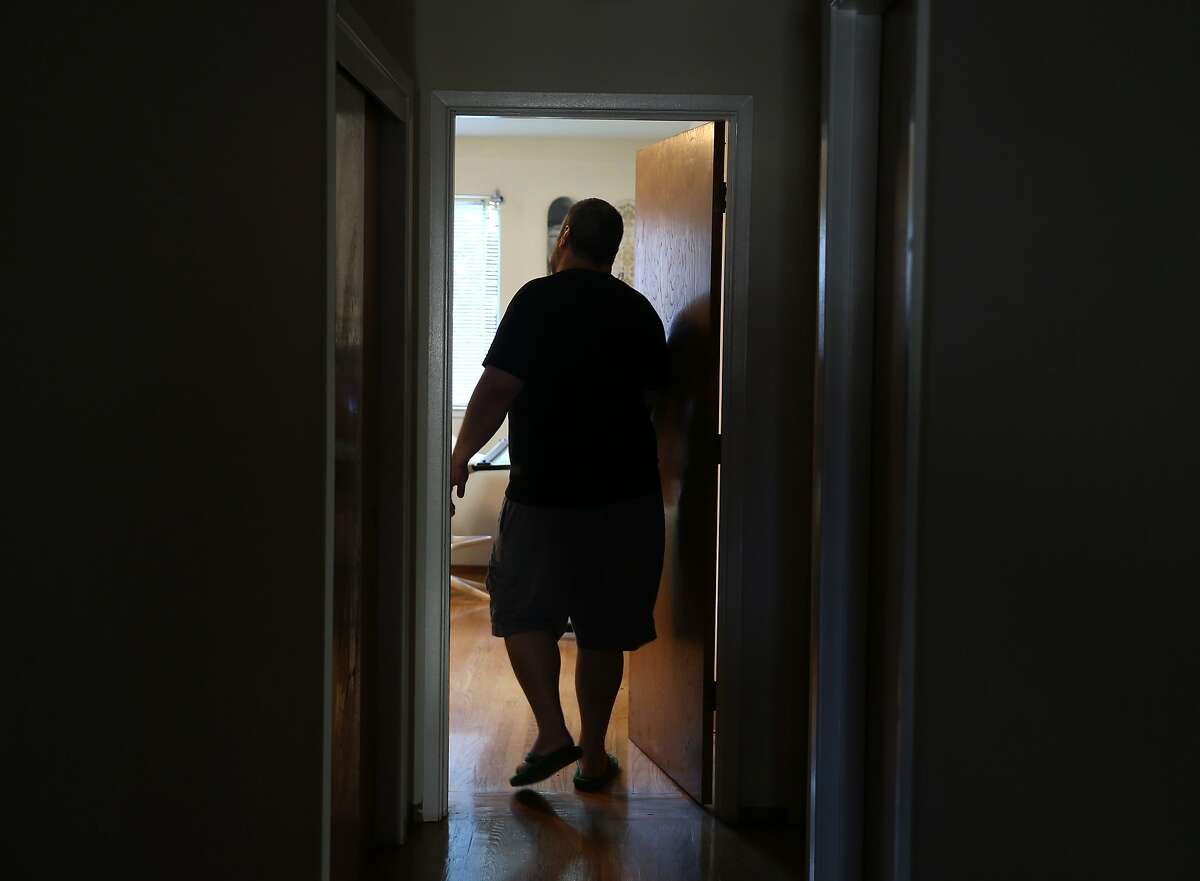 Edwin Neil Acosta walks into the bedroom of his apartment in San Francisco, Calif. on Wednesday, March 25, 2015. Acosta's life is returning to normal after enduring two years of constant noise coming from as many as 10 temporary residents at a time that would be staying in the apartment above his in an Airbnb-style arrangement with the tenant, who eventually moved out following numerous complaints from Acosta.