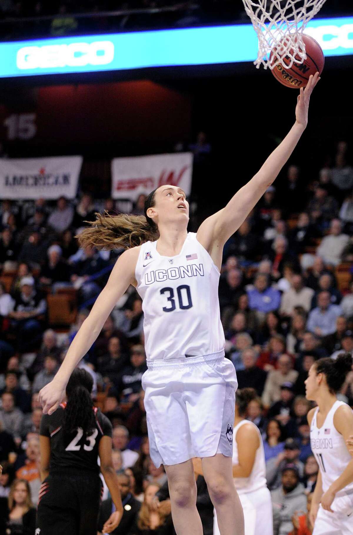 Connecticut's Breanna Stewart (30) scores during the first half of an gainst Cincinnati in the quarterfinals of the American Athletic Conference tournament in Uncasville, Conn., on Saturday, March 7, 2015. (AP Photo/Fred Beckham) ORG XMIT: CTFB105