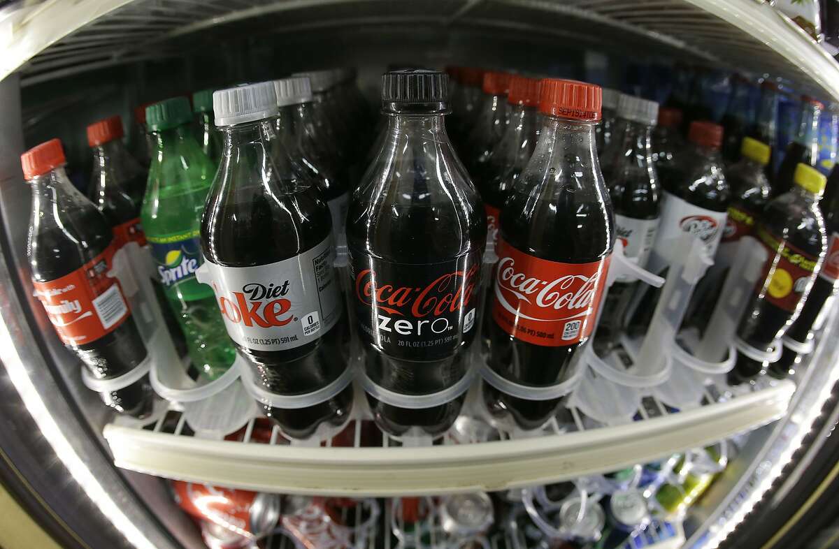 Americans bought less soda for the 10th straight year in 2014, with diet sodas shrinking more than their sugary counterparts, according to a new report.