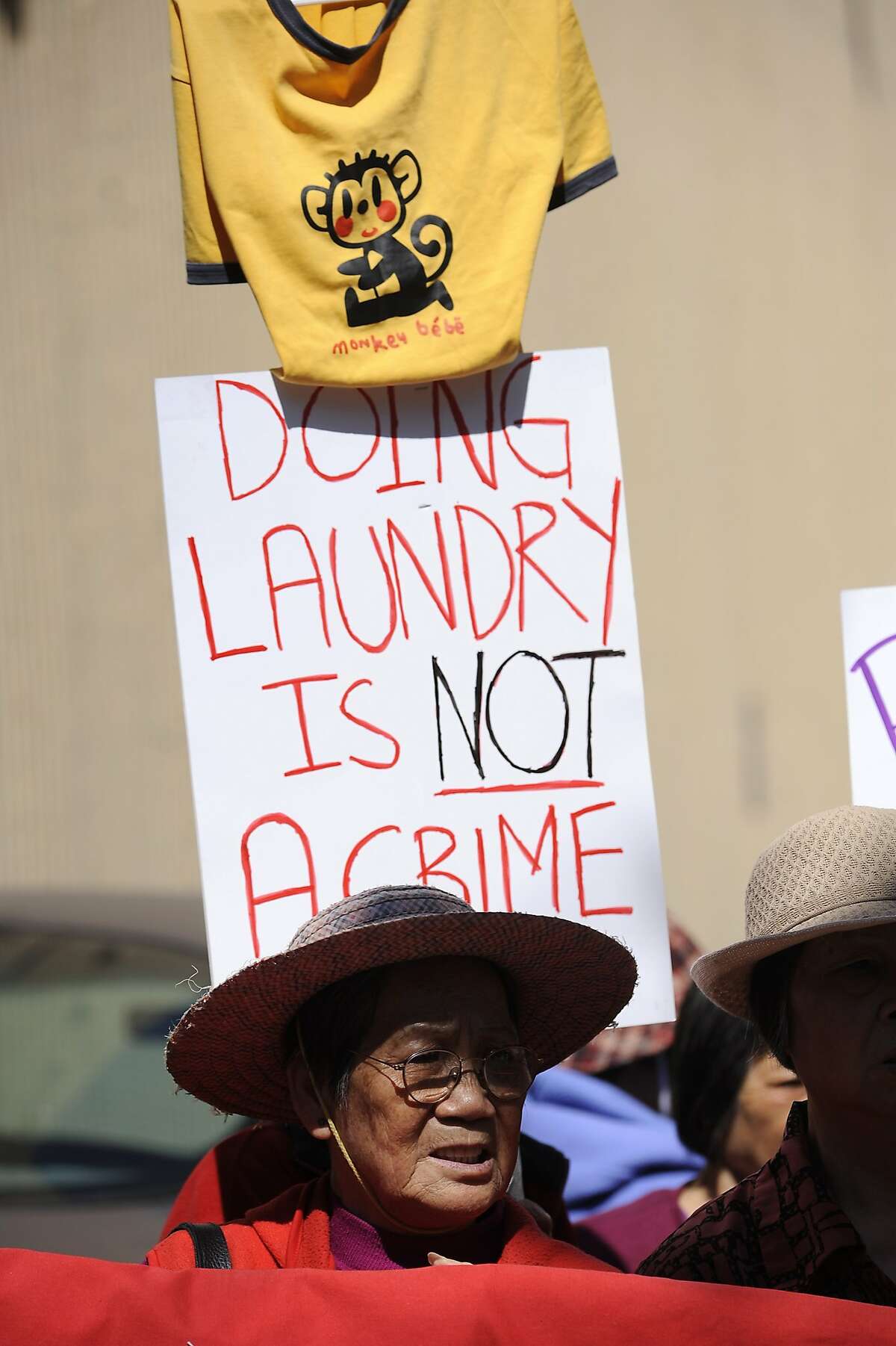 Tenants and activists protest in front of the Vallejo Emery Apartments in Chinatown who's owner they say is trying to evict longtime residents so that the rooms can be rented to higher paying tech workers, in San Francisco, CA, on Thursday, March 26, 2015.