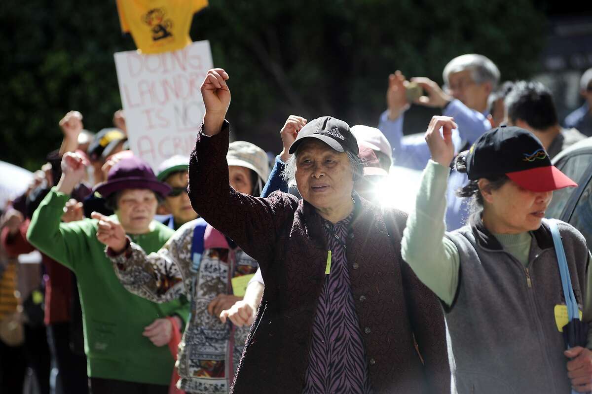 Tenants and activists march in protest in front of the Vallejo Emery Apartments in Chinatown who's owner they say is trying to evict longtime residents so that the rooms can be rented to higher paying tech workers, in San Francisco, CA, on Thursday, March 26, 2015.