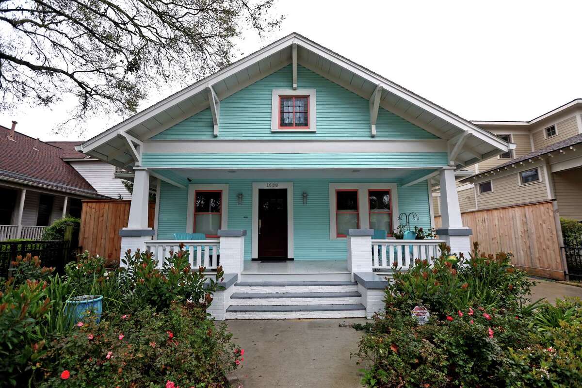 Peggy Gilbert painted the outside of her 1920s bungalow a Tiffany blue, a Sherwin-Williams shade called Spa.