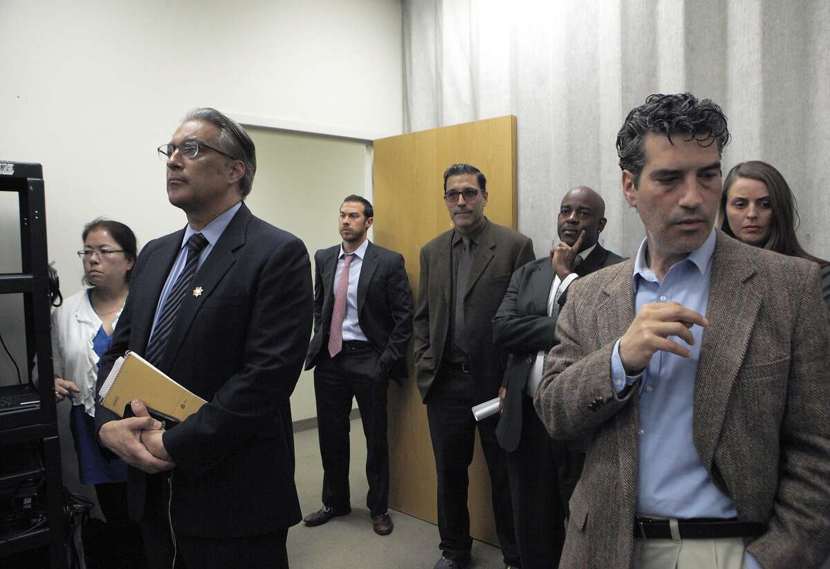 S.F. Sheriff Ross Mirkarimi (second from left) listens in to public defender Jeff Adachi during a news conference about S.F. sheriff deputies staging cage-fight style matches between inmates for their entertainment and gambling purposes, pictured at the S.F. Public Defender's Office, Thursday, March 26, 2015, in San Francisco, Calif.