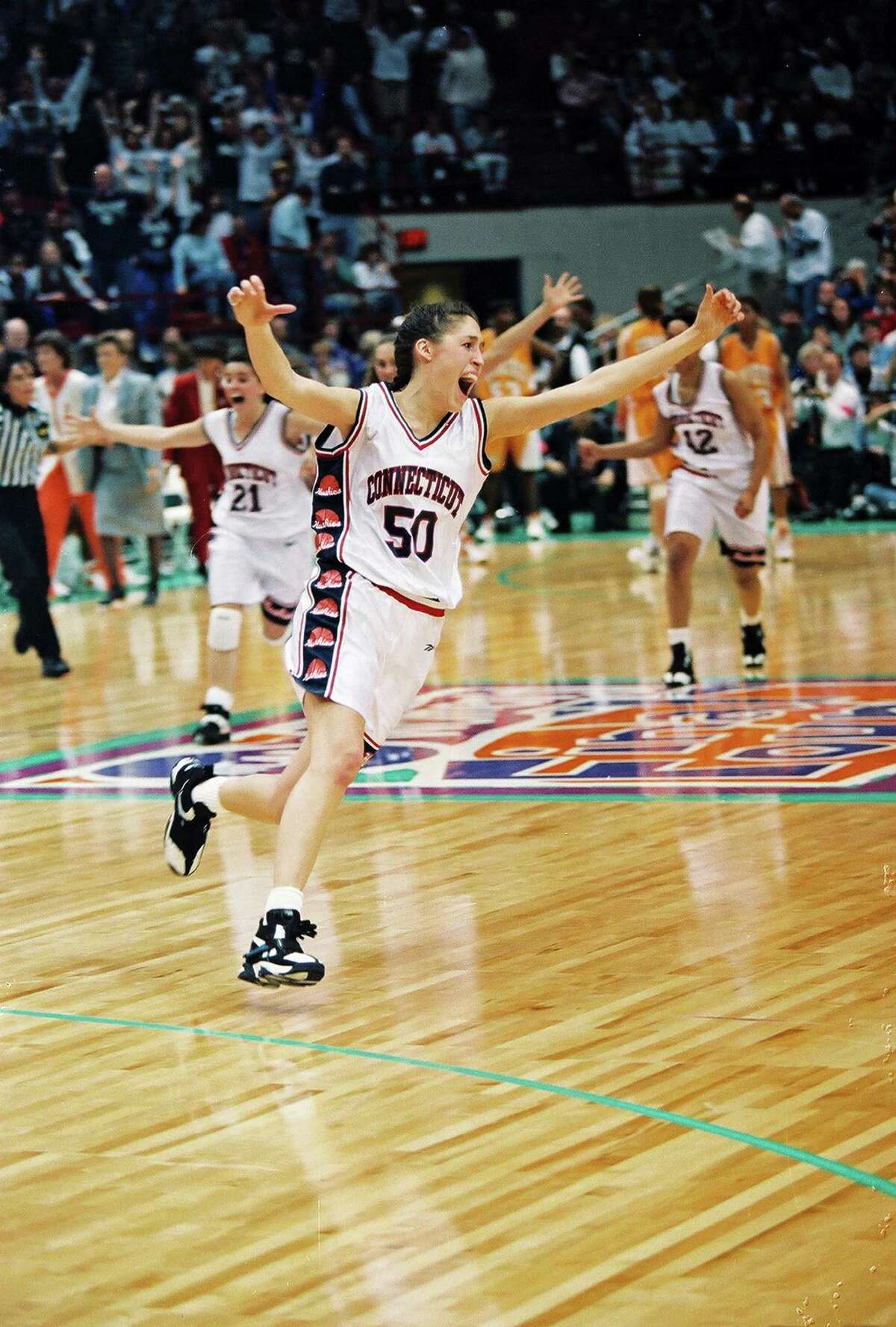Rebecca Lobo celebrates UConn's first national championship in 1995. The Huskies capped a perfect season with a 70-64 victory over Tennessee at the Target Center in Minneapolis.