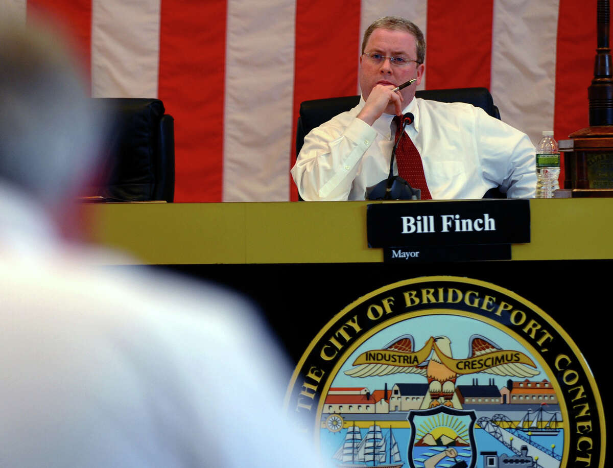 Bridgeport City Council President Tom McCarthy, resides over a meeting at Bridgeport City Hall in Bridgeport, Conn. The state law allows his duel roles as deputy director of labor relations and council president.