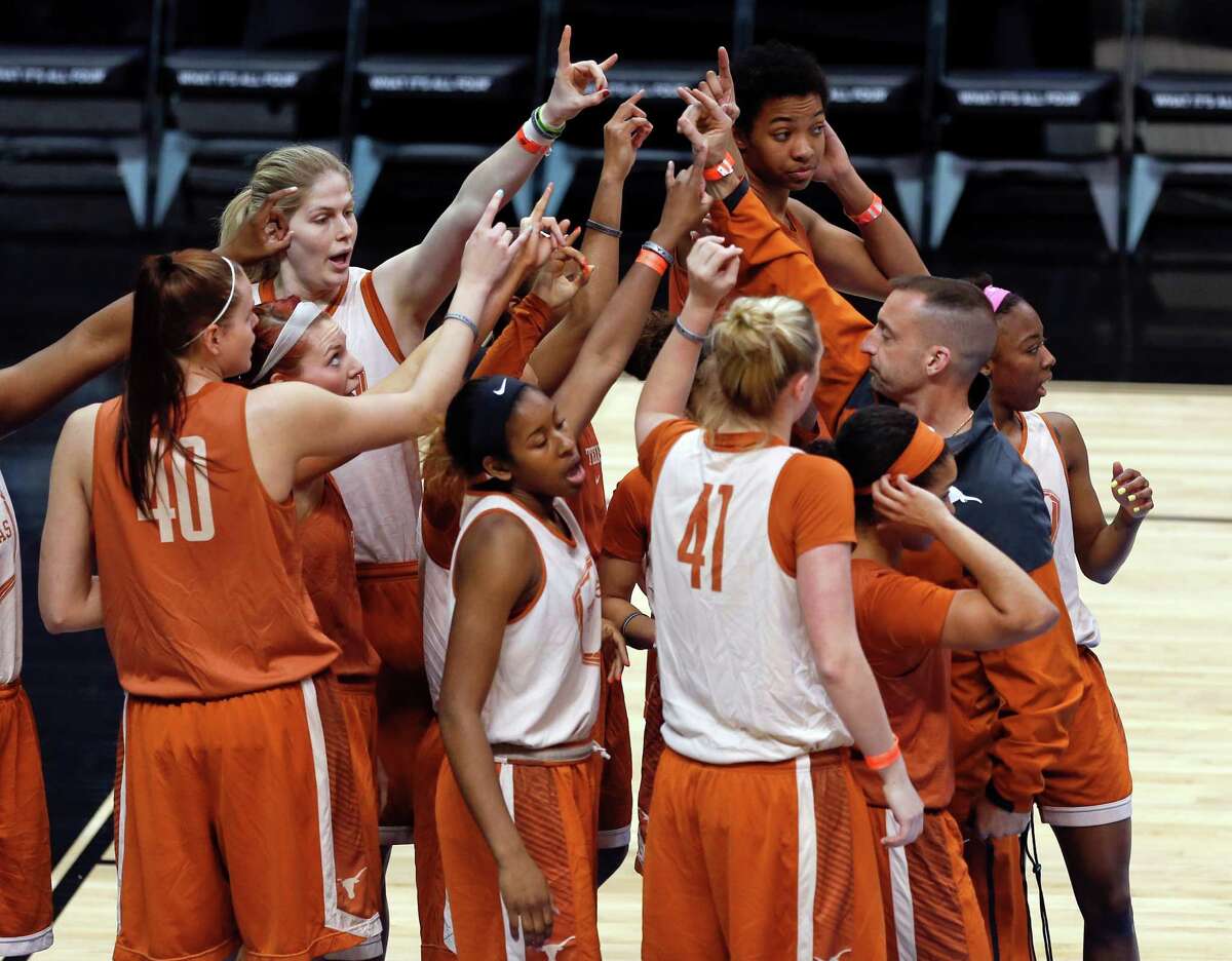 Texas players gather during practice for a women's college basketball regional semifinal game in the NCAA Tournament on Friday, March 27, 2015, in Albany, N.Y. Texas plays Connecticut on Saturday. (AP Photo/Mike Groll) ORG XMIT: NYMG119