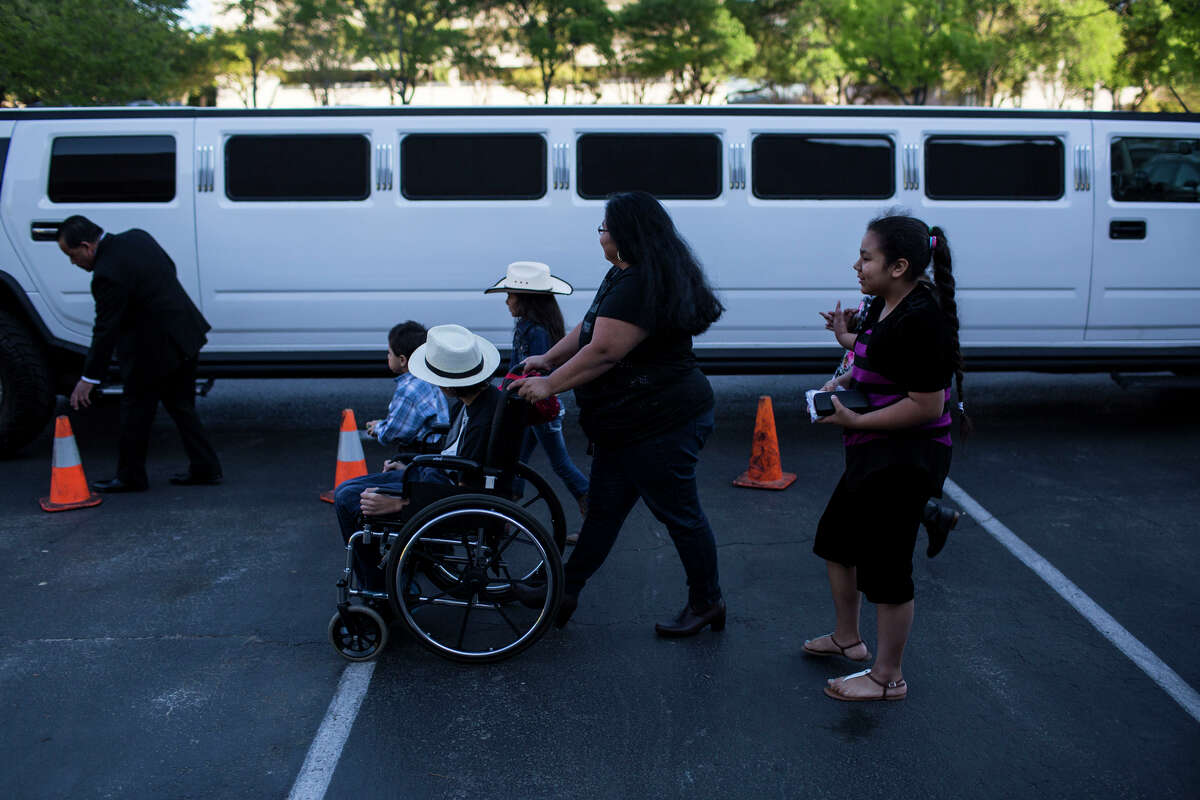 Rose Sanchez pushes her son Danny Sanchez in a wheelchair towards a limo during the 15th Annual Little Heroes Prom for hundreds of children with cancer across South Central Texas at the Omni Hotel in San Antonio, TX on Friday, March 27, 2015. Danny Sanchez, who was diagnosed with a brain tumor, is attending the prom for the first time. "I think it is important for kids like Danny to have a good time and feel included," Rose Sanchez, Danny's mother, said. The family, which included Danny's four brothers and sisters, mother and grandparents, got a ride in the limo before going into the prom.