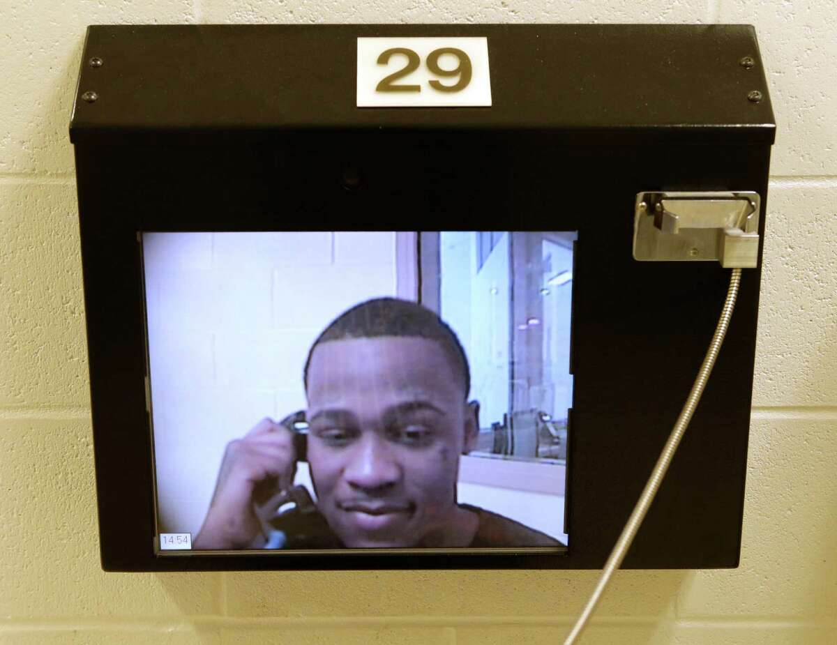 Neisha Dshawn Minger speaks via video to her boyfriend, Gerald Powell, who is being held at the Fort Bend County jail﻿ in Richmond. ﻿