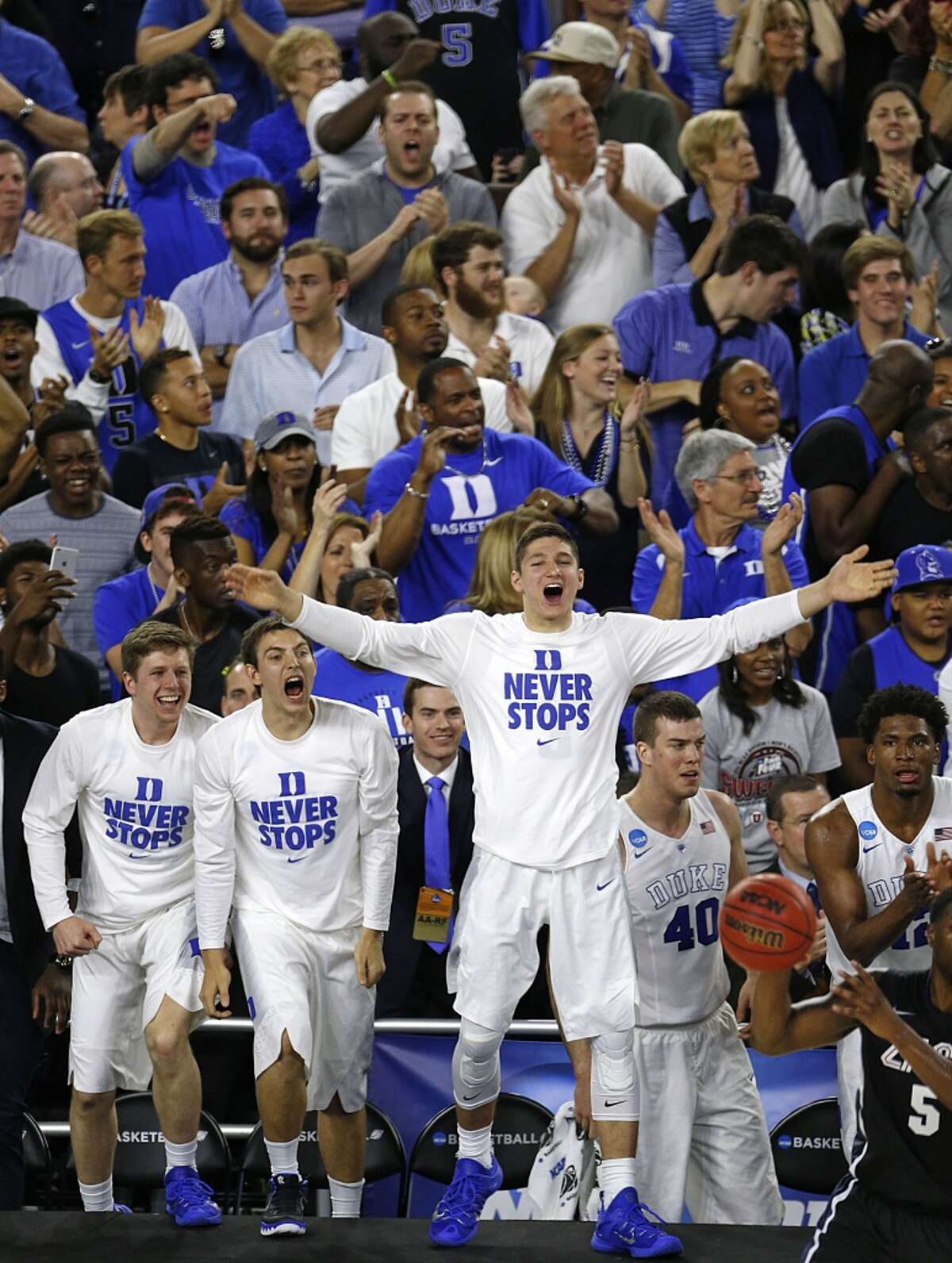Duke Blue Devils guard Grayson Allen center, celebrates on the sidelines during the second half of the NCAA South Regional final game against the Gonzaga Bulldogs at NRG Stadium Sunday, March 29, 2015, in Houston. ( James Nielsen / Houston Chronicle )