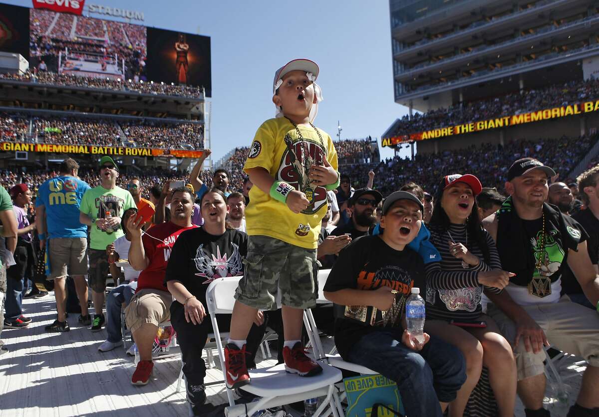 Alex Valencia, 6, of El Sobrante cheers on his favorite wrestlers during WrestleMania 31at Levi's Stadium in Santa Clara, Calif. Sunday, March 29, 2015.
