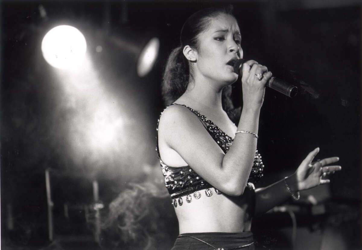 Selena Quintanilla performs for the crowd during a dance following the Feria de las Flores queen's contest at Memorial Coliseum Aug. 12, 1989, in Corpus Christi.