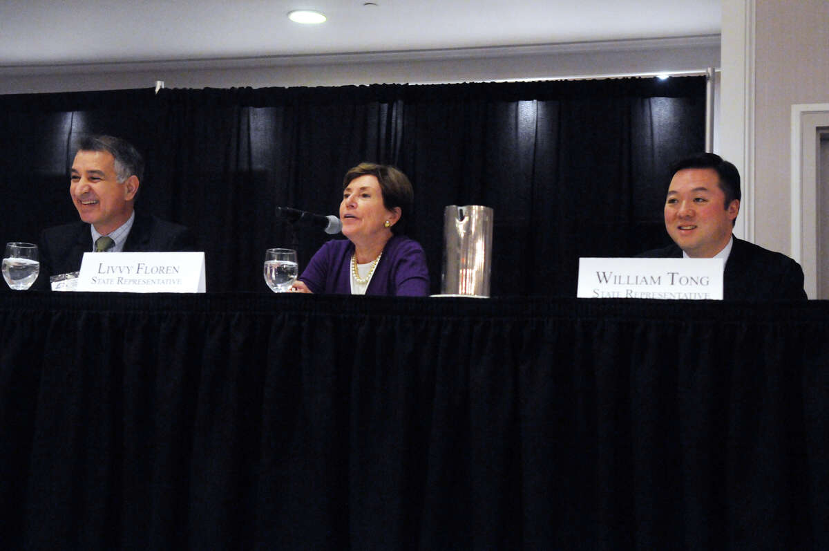 State Senator Carlo Leone and State Reps. Livvy Floren and William Tong are part of the Stamford General Assembly delegation sitting on a panel during the Stamford Chamber of Commerce's annual legislative breakfast at the Crowne Plaza Hotel in Stamford, Conn., March 31, 2015.
