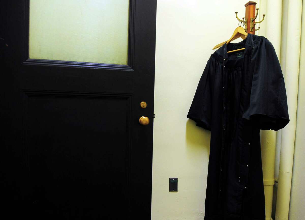 The black robe worn by Ellen Bree Burns, a Senior United States federal judge at Federal Courthouse in New Haven, hangs outside of her courtroom in New Haven. After almost 40 years on the bench, Burns will be retiring at 91 years old.