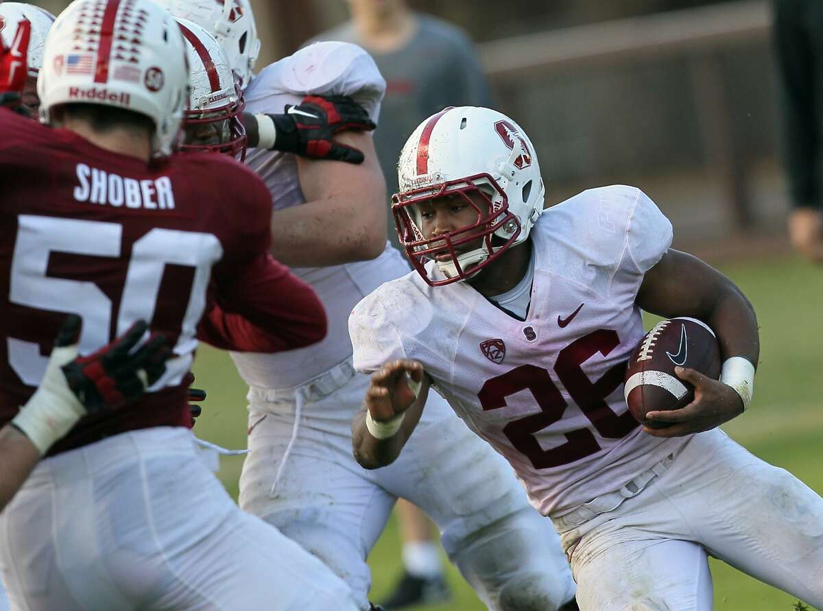 Stanford Cardinal running back Barry Sanders (26) finds an open lane to run with the ball during football practice at the Dan Elliott Practice Field, Saturday, Feb. 28, 2015, in Stanford, Calif.