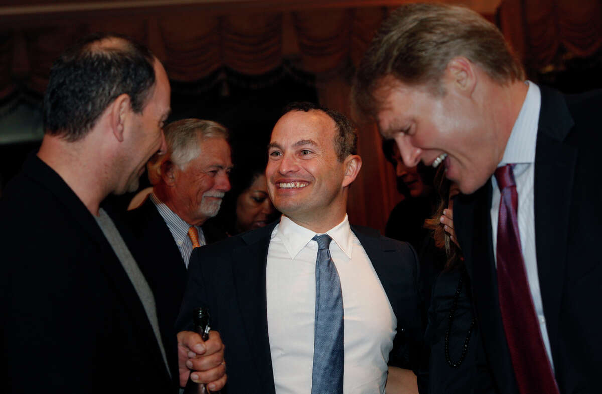Evan Marwell (center), CEO and founder of Education Superhighway, reacts after being named the San Francisco Chronicle's Visionary of the Year recipient at the Fairmont Hotel, Tuesday, March 31, 2015, in San Francisco, Calif.
