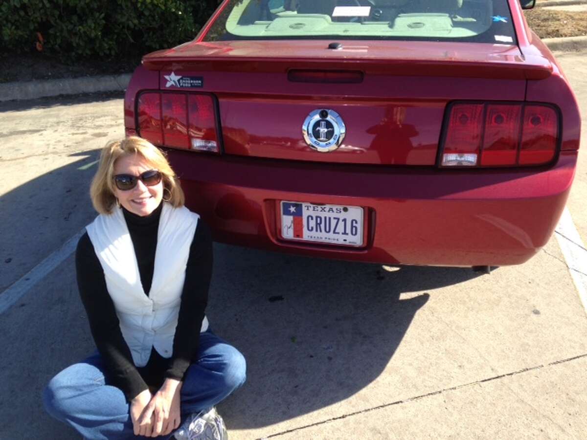 San Antonio woman Deborah Wall poses with her Ford Mustang bearing license plates with the phrase "CRUZ16" in support of U.S. Sen. Ted Cruz, R-Texas, who announced his intent to run for president on March 23. The back license plate also features an autograph from Cruz. Wall later stuck the plates on her 2015 Ford Mustang.