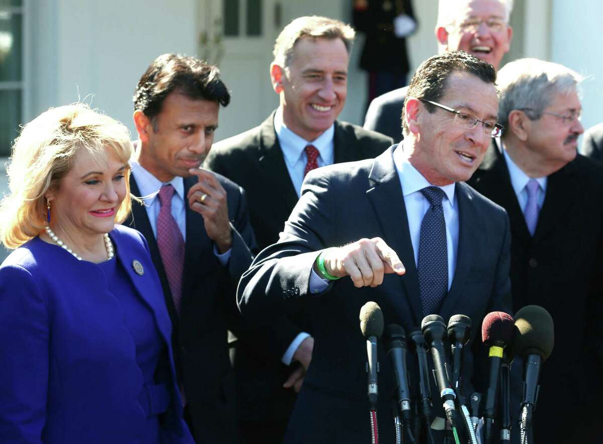 Connecticut Gov. Dannel Malloy (C) speaks while flanked by Gov. Mary Fallin, (R-OK) (L), Gov. Bobby Jindal (D-LA) (2ndL), and other members of the National Governors Association, after a meeting with President Barack Obama at the White House February 24, 2014 in Washington, DC.