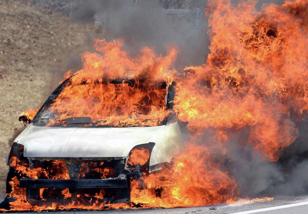 A car fire just north of the Twin Bridges slows northbound traffic Wednesday afternoon April 1, 2015 in Clifton Park, NY. (John Carl D'Annibale / Times Union)