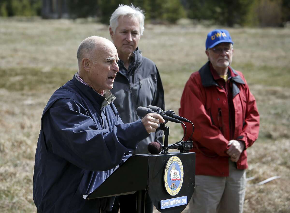 California Governor Edmund G. Brown Jr. talks about actions he is taking to save water in the State during this fourth year of drought, Frank Gehrke Chief of the California Cooperative Snow Surveys Program, (right) and Mark Cowin director of the department of water resources, (center) join the Governor during what would have been the fourth and final snow survey of the season if there was any snow, at Phillips Station, Calif., as seen on Wed. April 1, 2015.