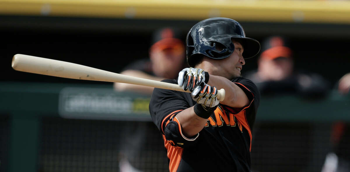 San Francisco Giants' Nori Aoki (23) in action during a spring training baseball game against the Oakland Athletics Tuesday, March 3, 2015, in Mesa, Ariz. (AP Photo/Darron Cummings)