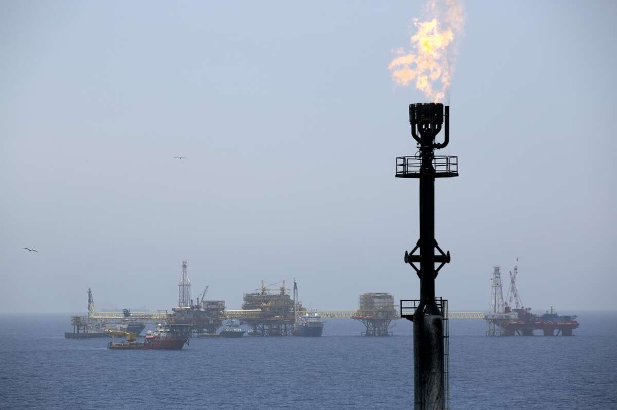 Gas is flared from a tower on an oil drilling rig operated by Petroleos Mexicans (Pemex) in the Ku-Maloob-Zaap oilfield at Campeche Bay off the coast of Ciudad del Carmen, Mexico. Mexico's Senate implemented a constitutional overhaul in Aug. 2014 ending Pemex's exclusive right to crude oil production, now in its 76th year. (Susana Gonzalez/Bloomberg)
