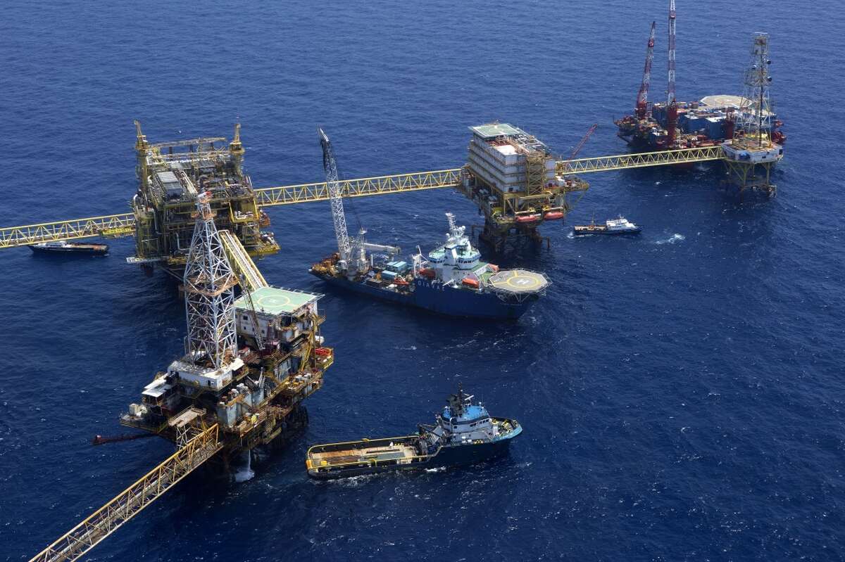 Oil drilling rigs operated by Petroleos Mexicans (Pemex) stand in the Ku-Maloob-Zaap oilfield at Campeche Bay.