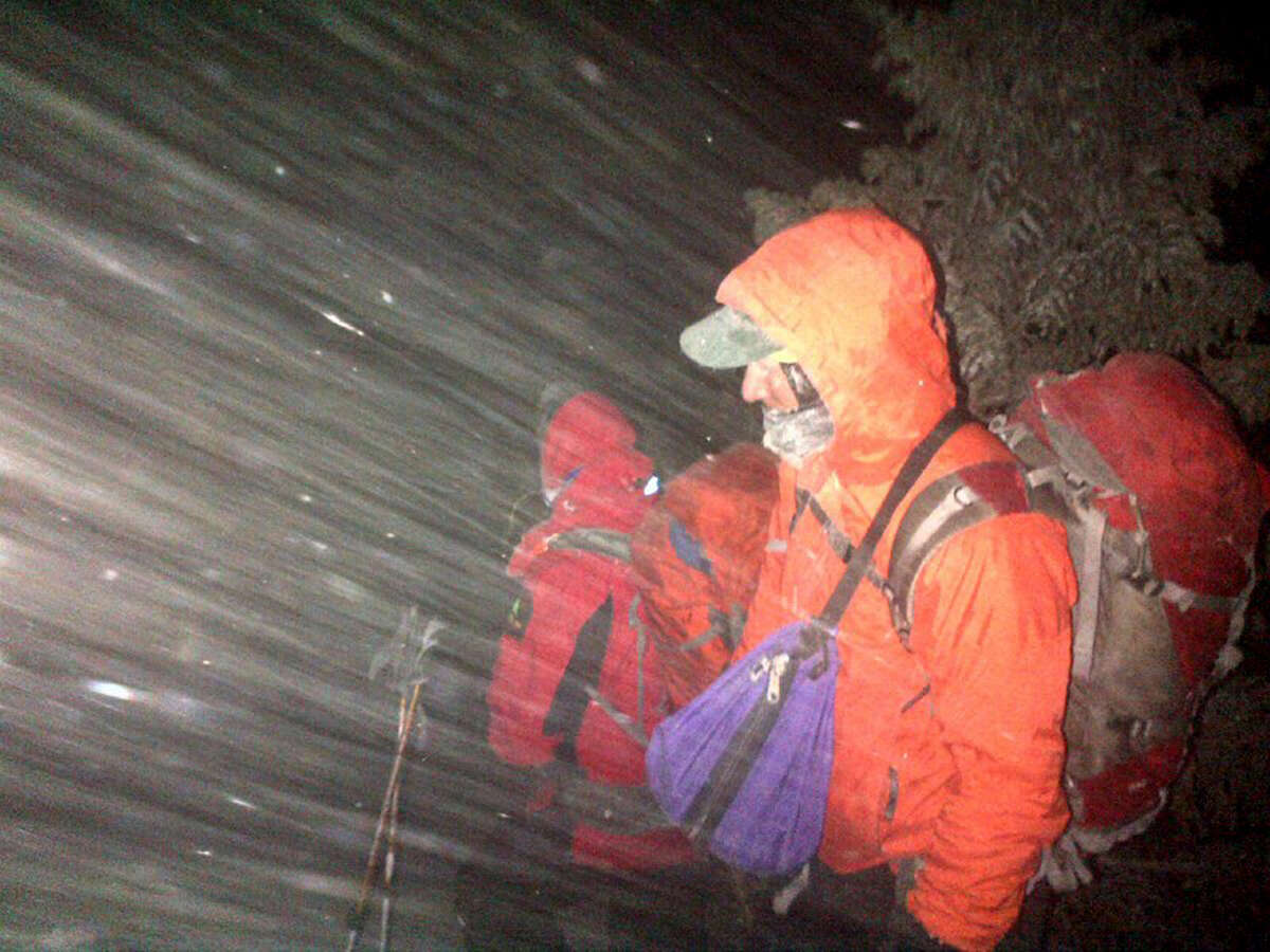 New York State Department of Environmental Conservation Forest Rangers search for a mother and her two sons on Mt. Marcy Saturday night, March 14, 2015, in Essex County, N.Y. (New York State DEC)