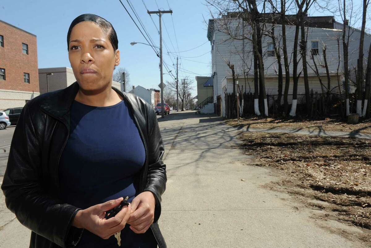 Celestal Hightower stands at the scene and talks about her cousin, Donald "Dontay" Ivy, who died after he was Tased and then chased by police near Lark Street and Second Street on Thursday April 2, 2015 in Albany, N.Y. (Michael P. Farrell/Times Union)