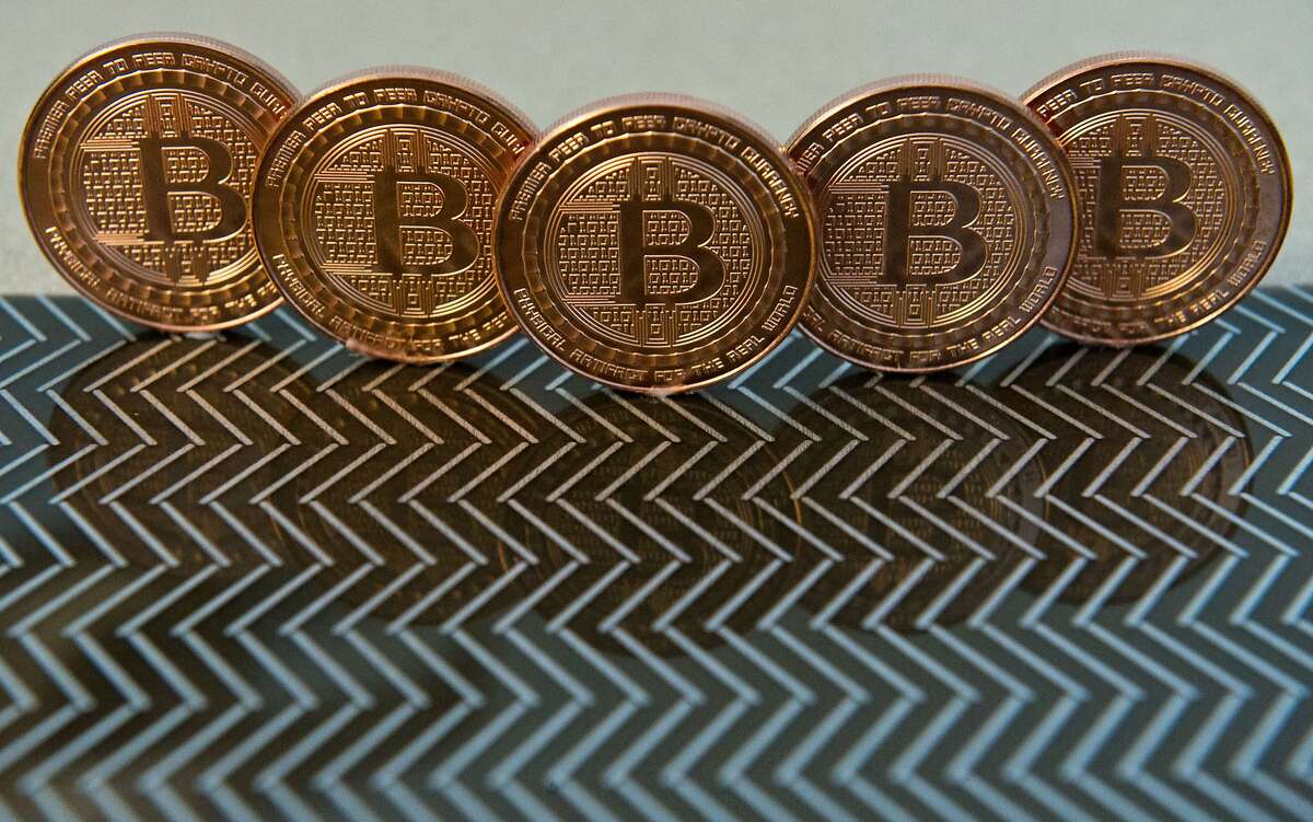 (FILES) This June 17, 2014 file photo photo taken in Washington, DC shows bitcoin medals. Noble Markets said March 24, 2015 it is adopting Nasdaq technology for its planned Bitcoin exchange, aiming to give institutional investors a credible platform for trading the digital currency. The startup said it would implement Nasdaq's X-stream Trading technology, already used by more than 30 smaller markets worldwide, to bring the Bitcoin trade to the Wall Street mainstream from often murky fringe exchanges. AFP PHOTO / Karen BLEIER / FILESKAREN BLEIER/AFP/Getty Images
