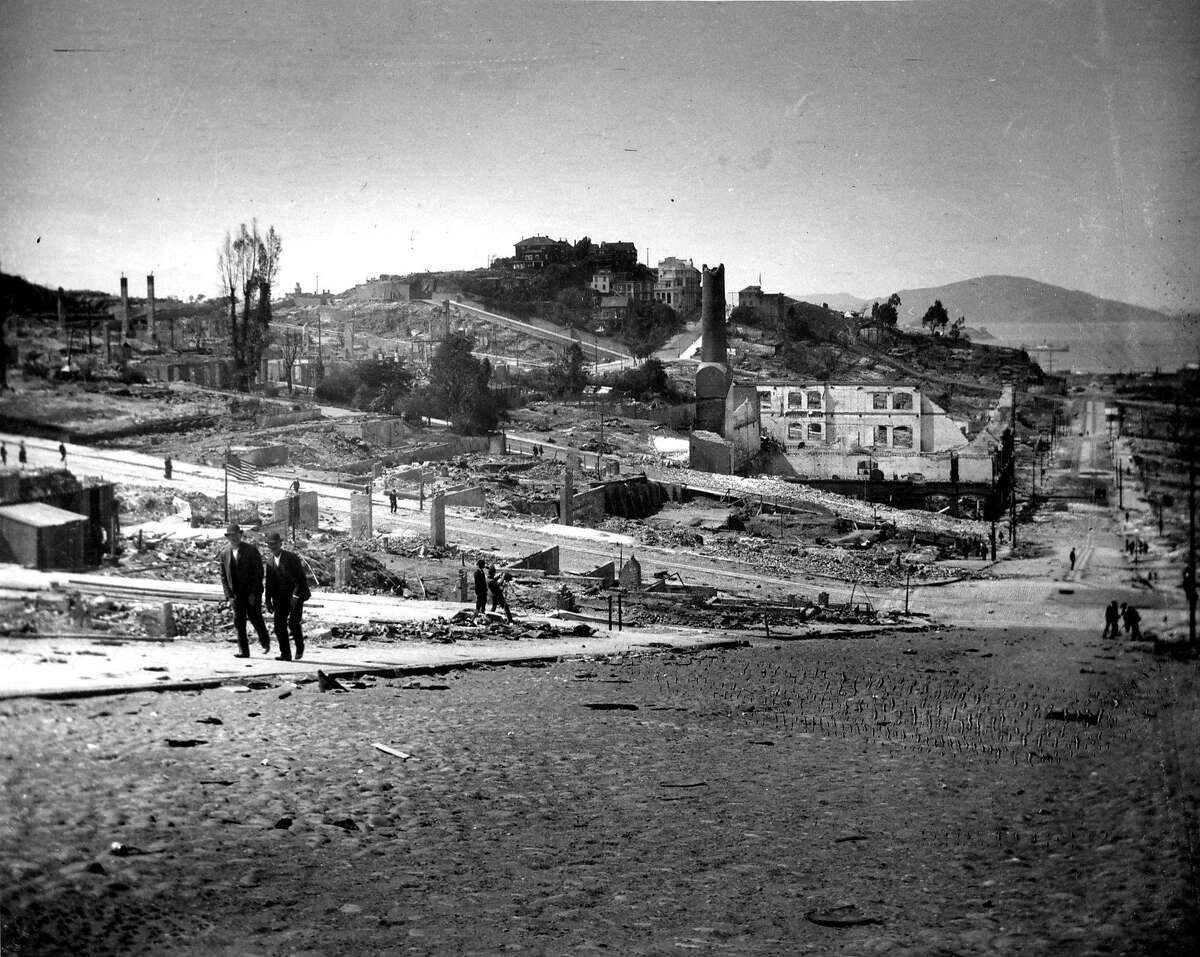 1906 earthquake photo from The San Francisco Chronicle archive. Photographer unknown. Looking down at Russian Hill, cable car barn and Washington and Mason streets.
