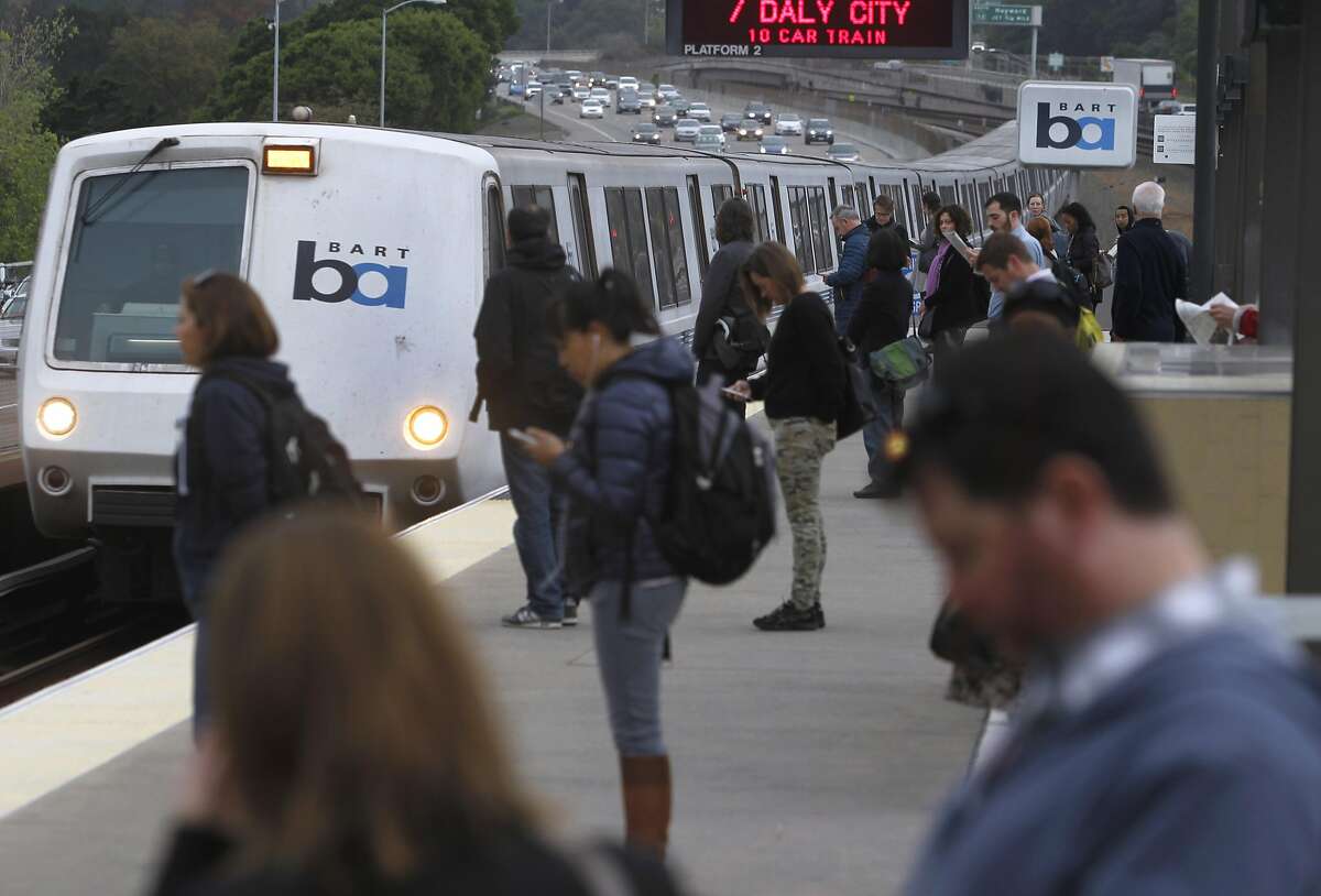 Commuters line up to board a San Francisco train arriving at the Rockridge BART station in Oakland, Calif. on Tuesday, March 24, 2015. Ridership continues to rise on the regional transit system.