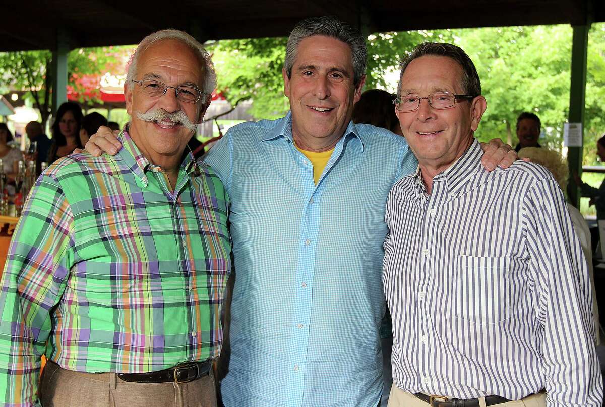 Event auctioneer and restaurateur LeGrande Serras, left, poses in 2013 with Richard Yulman, center, and Peter Sherman during the 22nd Annual Double H Ranch Gala in Lake George. Yulman recalled Donald "Dontay" Ivy as "a great kid."