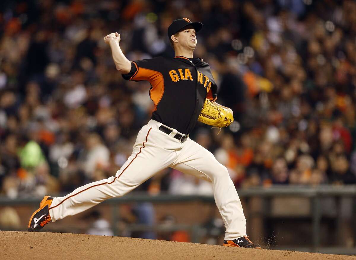 San Francisco Giants pitcher Matt Cain winds up during the fourth inning of the baseball game against the Oakland Athletics on Friday, April 3, 2015 in San Francisco, Calif.