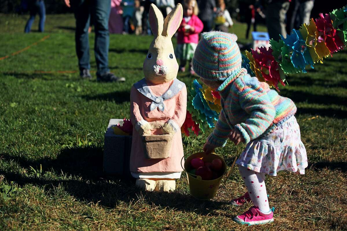 Audrey Jeter checks out bunny at the annual Easter egg hunt in Duboce Park in San Francisco, Calif., Saturday April 4, 2015.