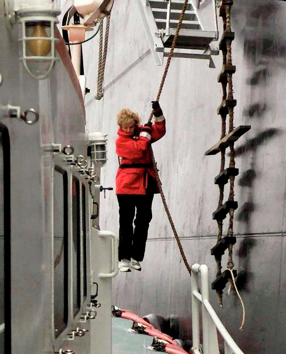 Nancy Wagner descends from a ship at sea to a pilot boat by using what sailors call a Jacob’s ladder. Wagner was the first female ship pilot in the U.S.