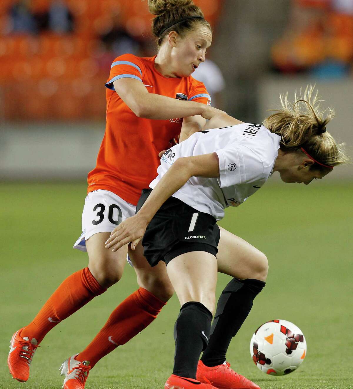 Houston Dash Ella Masar (30 has trouble going around Portland Thorns Nikkin Marshall (7) in the second half on May 14, 2014 at BBVA Compass Stadium in Houston, TX. Portland won 1 to 0. (Photo: Thomas B. Shea/For the Chronicle)