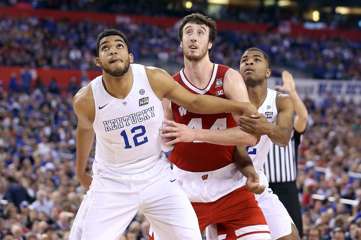 INDIANAPOLIS, IN - APRIL 04: Frank Kaminsky #44 of the Wisconsin Badgers battles for position on a against Karl-Anthony Towns #12 and Aaron Harrison #2 of the Kentucky Wildcats in the second half during the NCAA Men's Final Four Semifinal at Lucas Oil Stadium on April 4, 2015 in Indianapolis, Indiana. (Photo by Streeter Lecka/Getty Images)