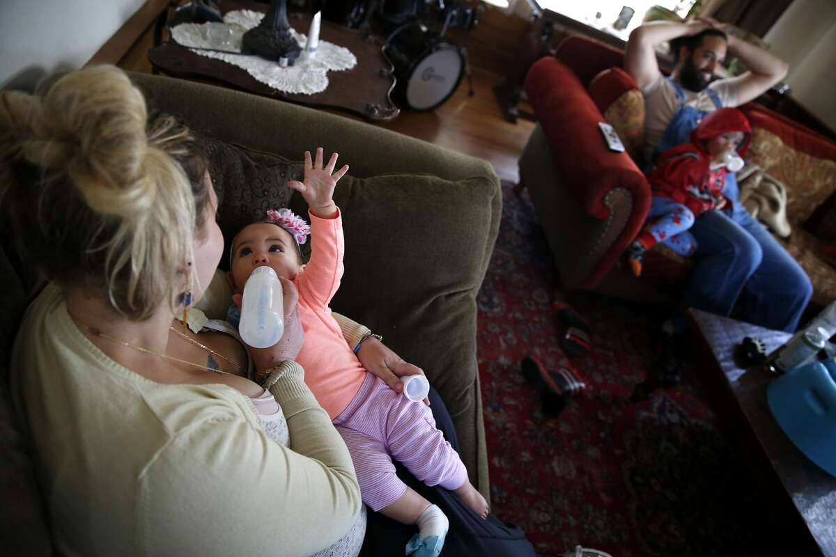 Sam Torreano feeds private donor breast milk to her 8-month-old baby Seneca Jahi in Oakland, Calif., on Sunday, April 5, 2015.