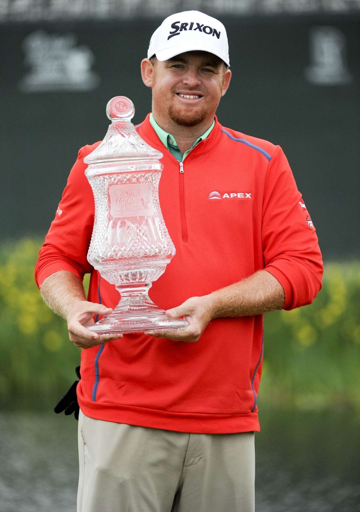 J.B. Holmes poses with the champion's trophy after winning the Shell Houston Open on the second playoff hole against Johnson Wagner, Sunday, April 5, 2015, at the Golf Club of Houston in Humble, TX. (Photo: Eric Christian Smith/For the Chronicle)