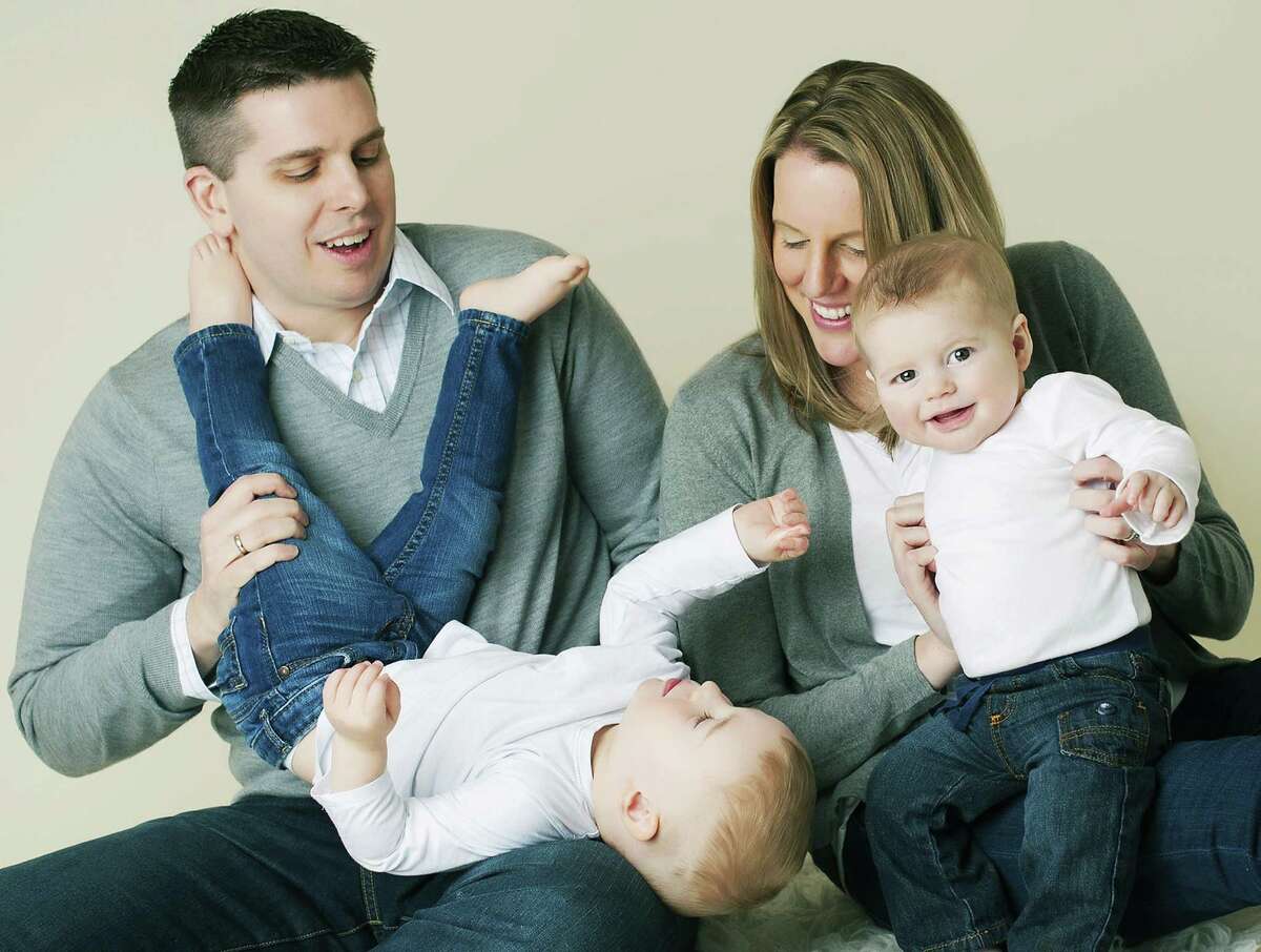 Jonathan and Kim Phillips, shown here frolicking with their sons, Graham and Benjamin, will serve April 26 as 2015 ambassadors for the March for Babies in Danbury, a benefit event for the March of Dimes. Courtesy of the March of Dimes