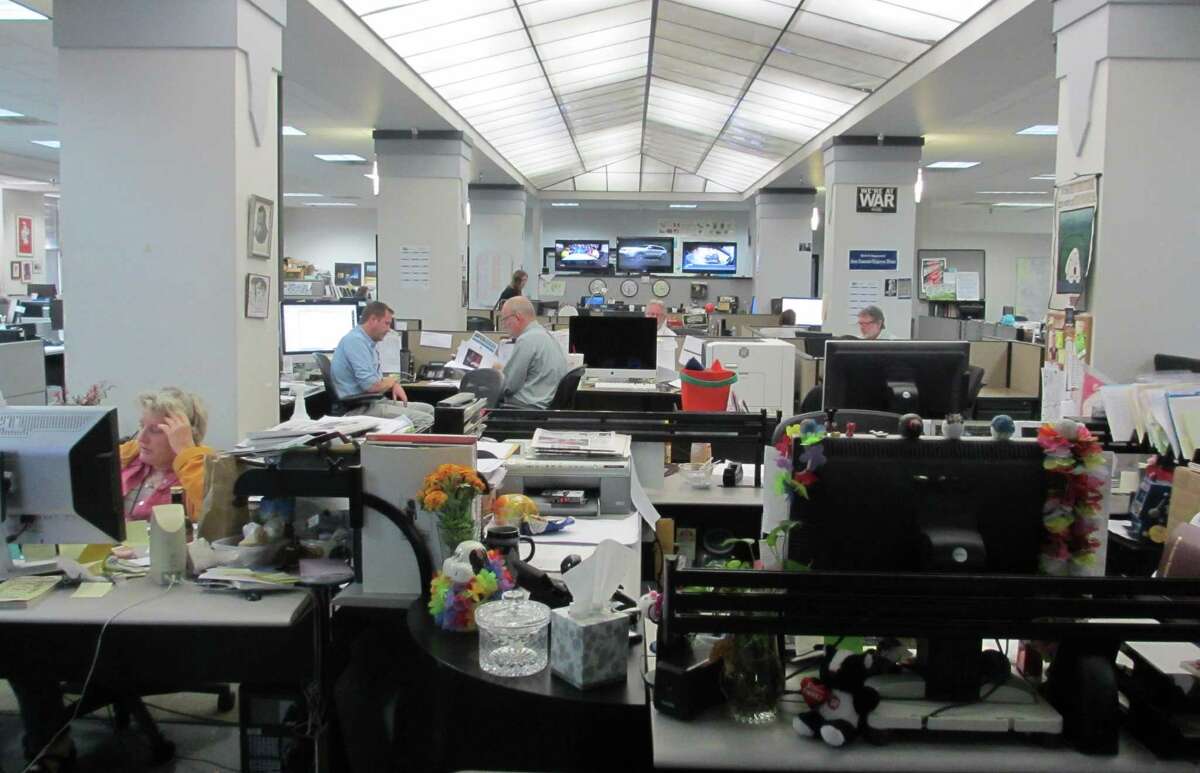 The evening crew in the San Antonio Express-News newsroom works on getting stories and photos ready for the Wednesday print edition and MySA.com and EN.com websites.