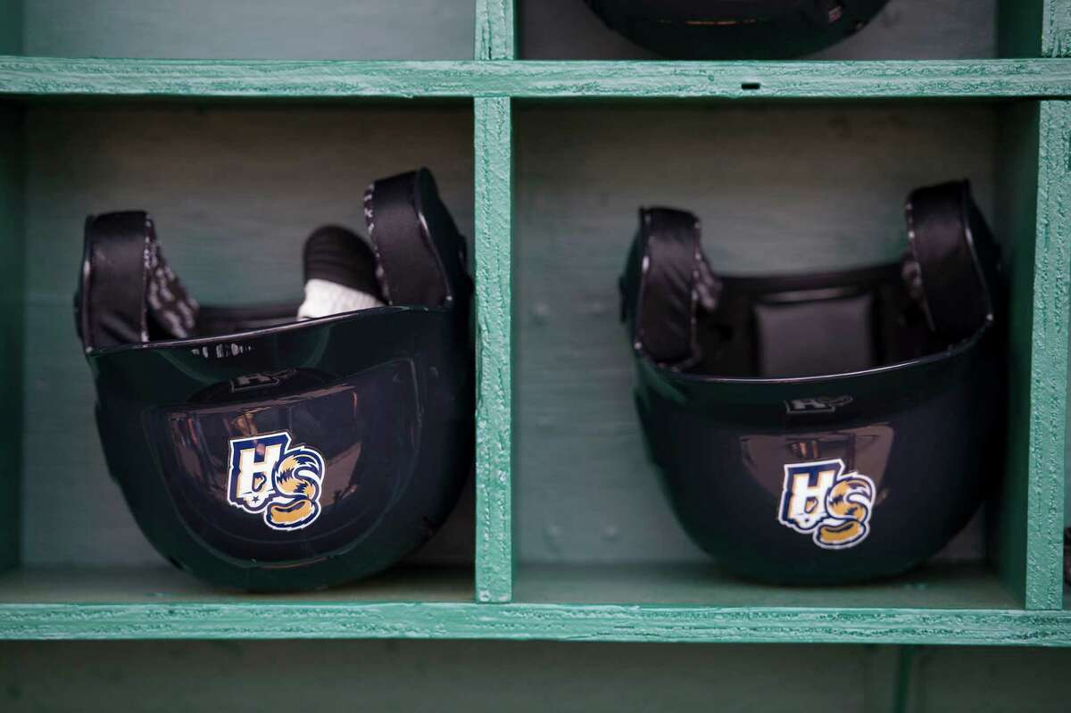 Batting helmets are pictured in the dugout during the Missions media day and practice session on April 7, 2015, at Wolff Stadium in San Antonio.