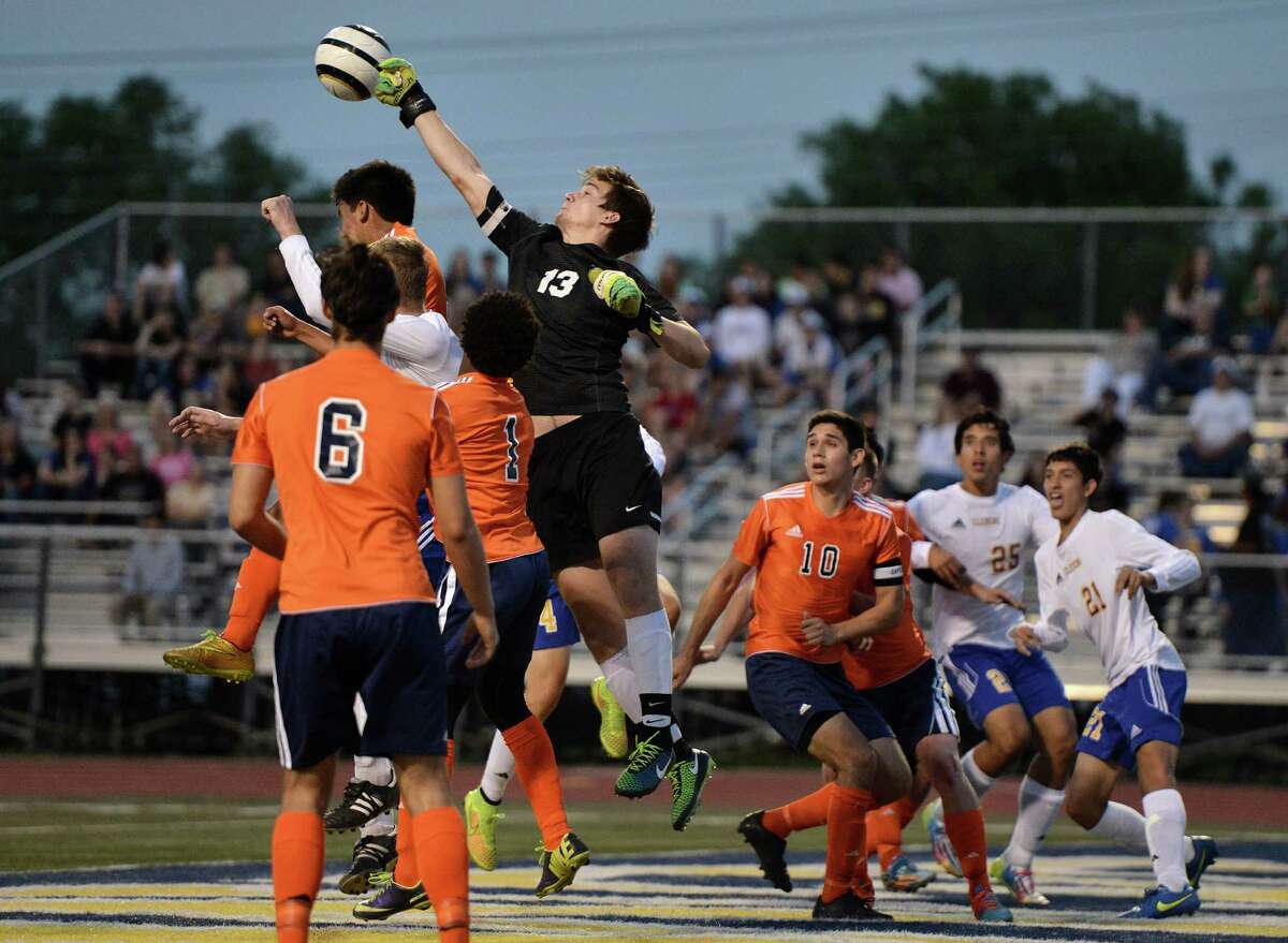 Brandeis goalie Tero Elias punches the ball away during the Class 6A third-round boys playoff game against Clemens on April 7, 2015. Brandeis won 4-0.