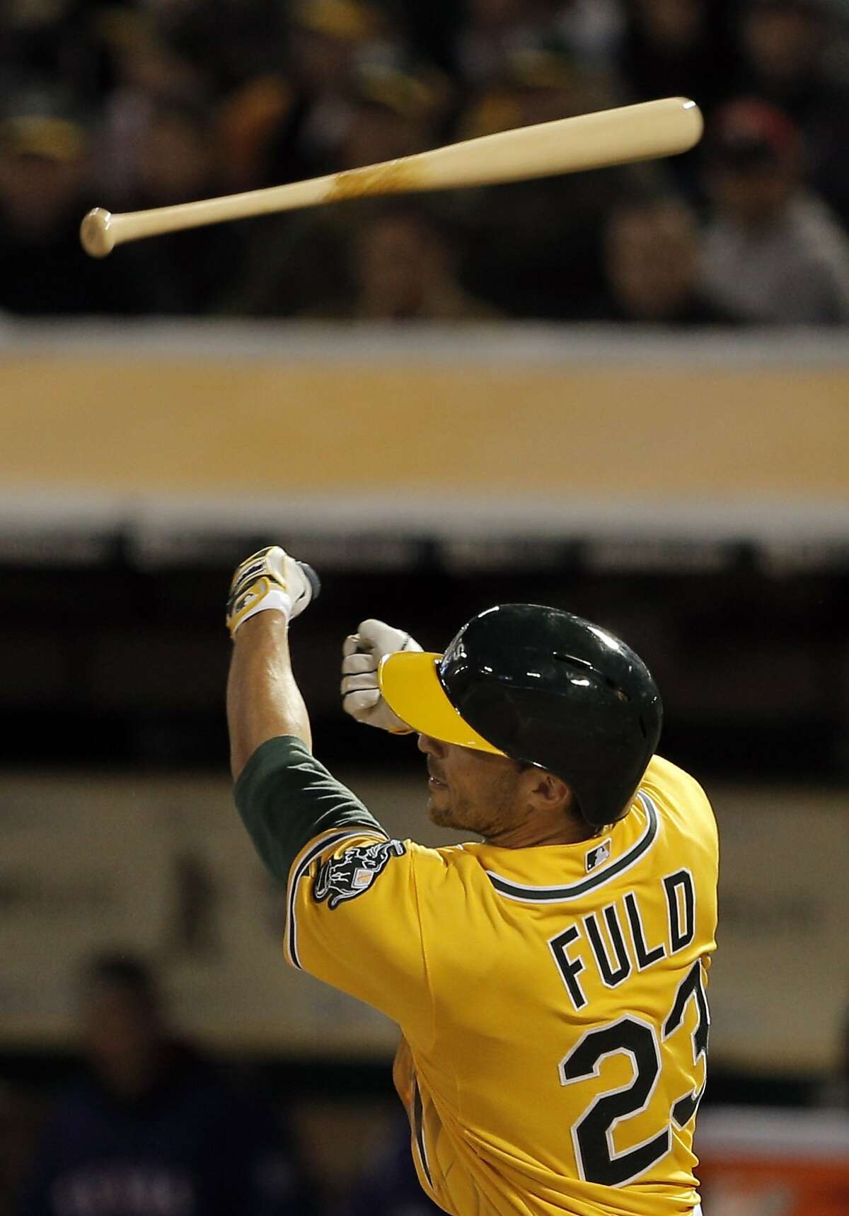 Sam Fuld (23) loses the grip on his bat in the third inning as the Oakland Athletics played the Texas Rangers at O.Co Coliseum on Tuesday, April 7, 2015, in Oakland, Calif.