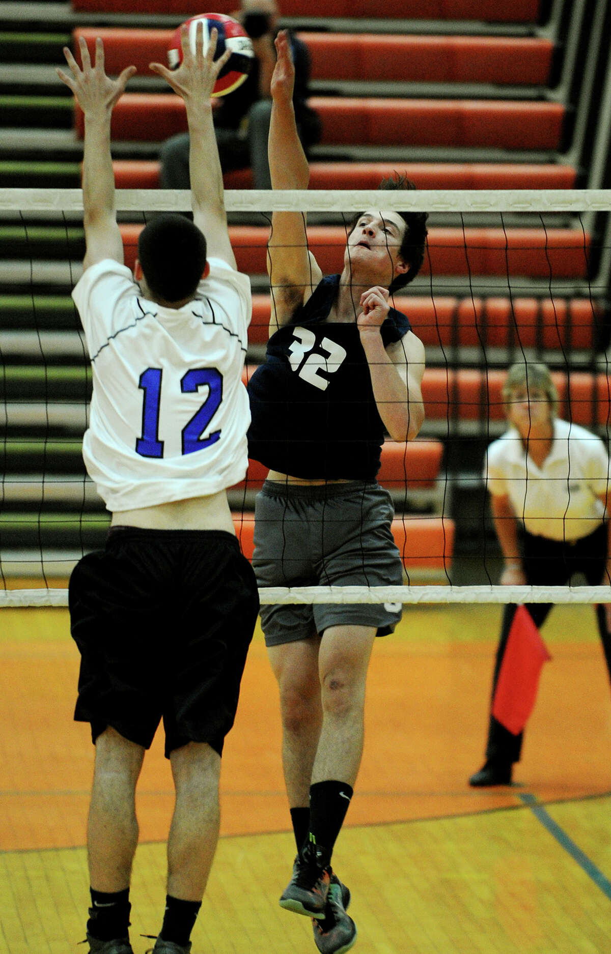 Staples' Chris Delaurentis spikes the ball as a Southington defender attempts to block during the Wreckers' loss in the Class L state boys volleyball semifinals at Shelton High School in Shelton, Conn. on Monday, June 9, 2014.